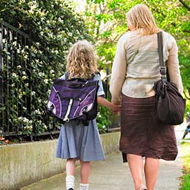 Child walking with a parent