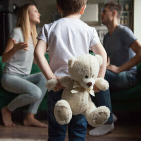 Child watching parents argue through a divorce